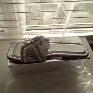 New in original box beautiful sandals.